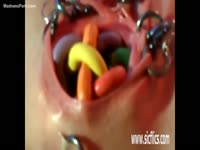 Colorful insertion movie that features a heavily pierced whore inserting candy in her sweet hole